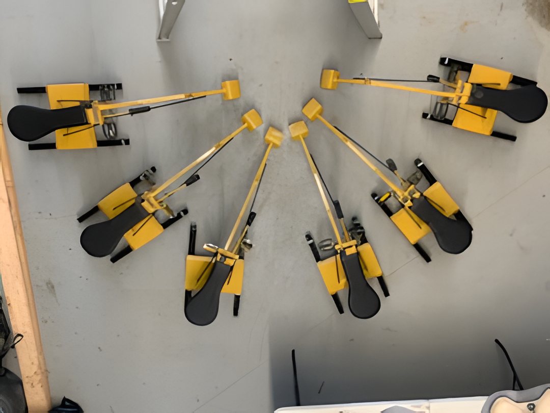 Bedrock Digger boom arms and buckets laid out during assembly