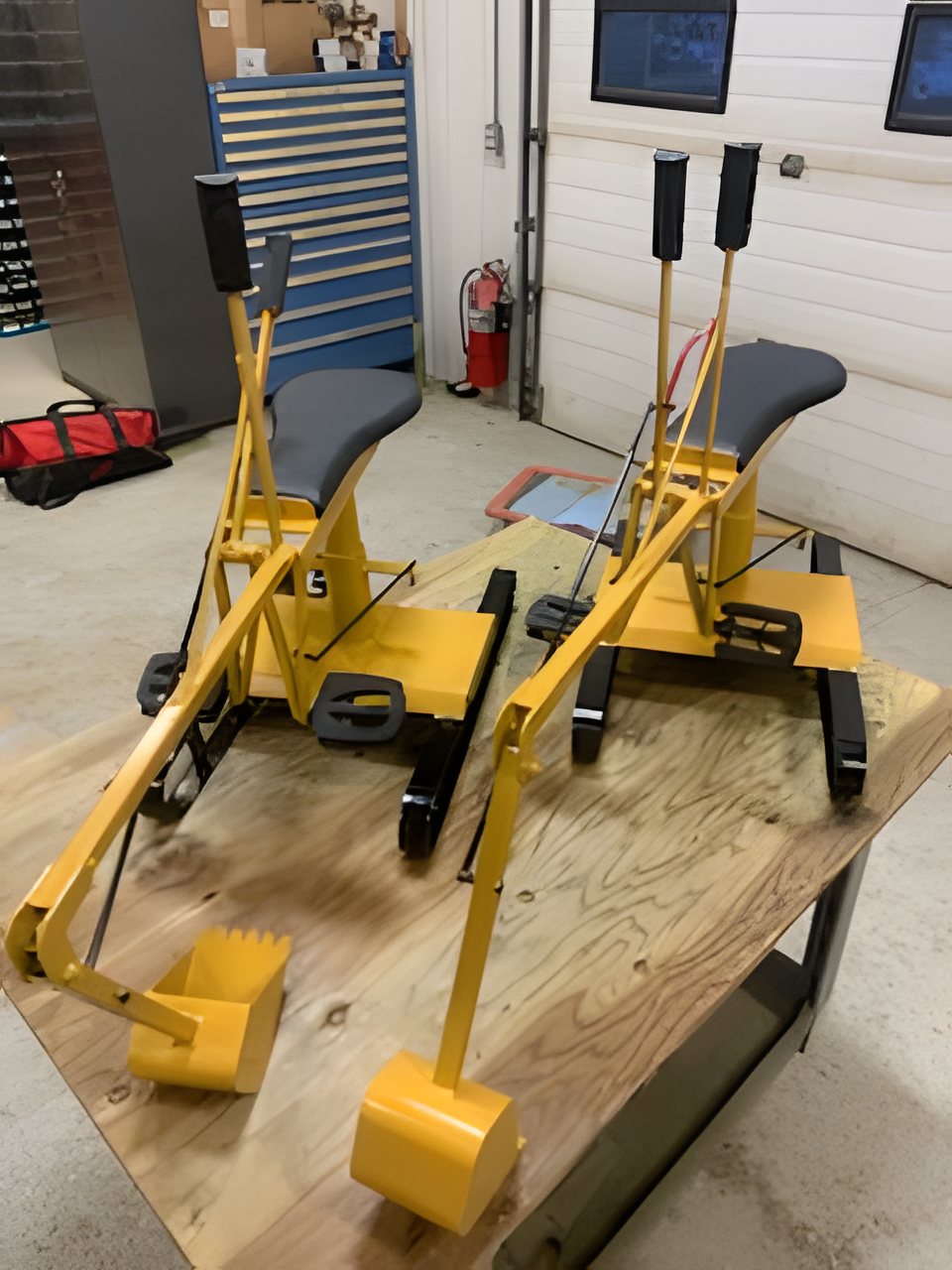 Two assembled Bedrock Diggers on the workbench in the shop